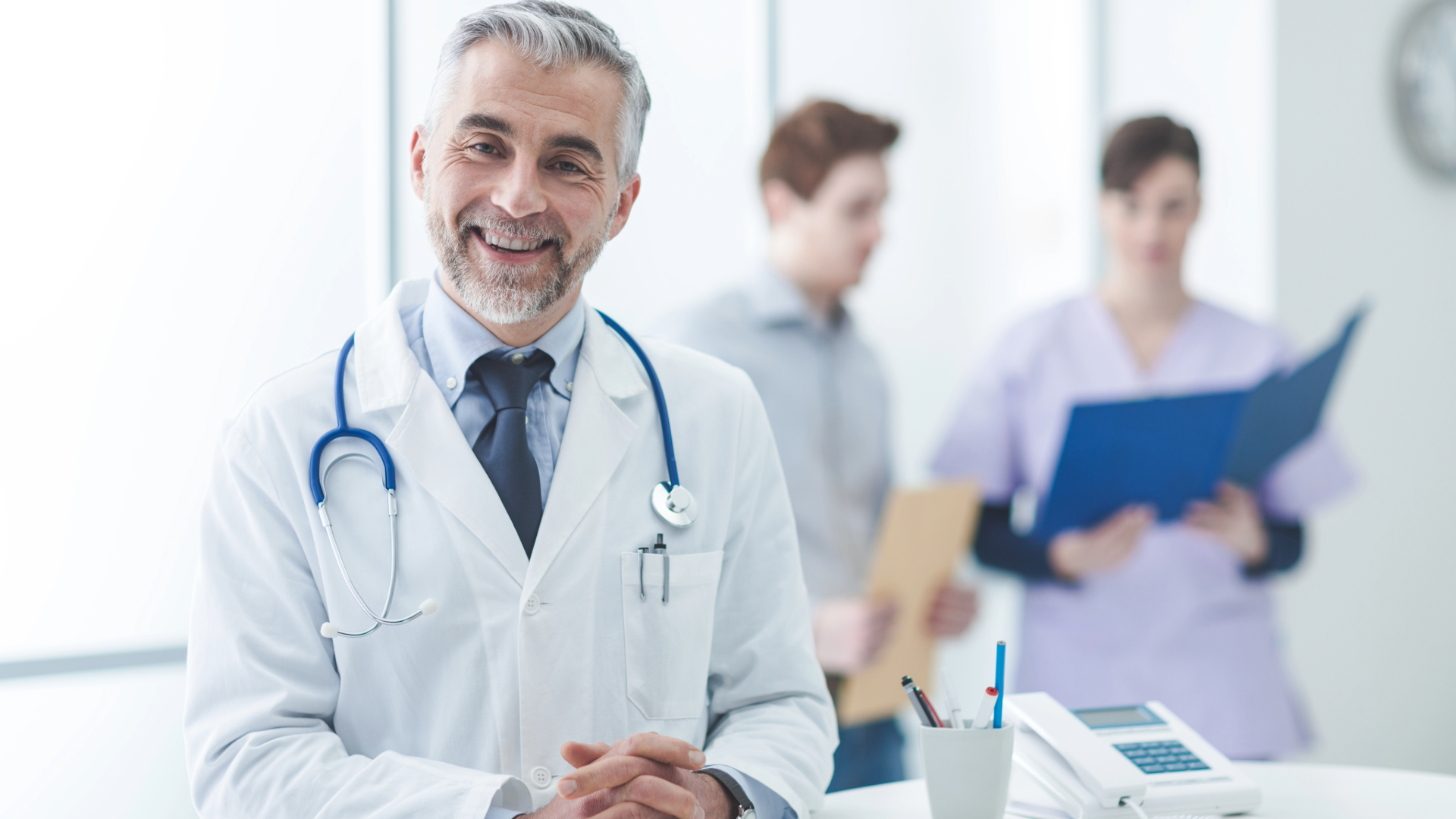 Confident senior physician at a successful practice with strong revenue cycle management