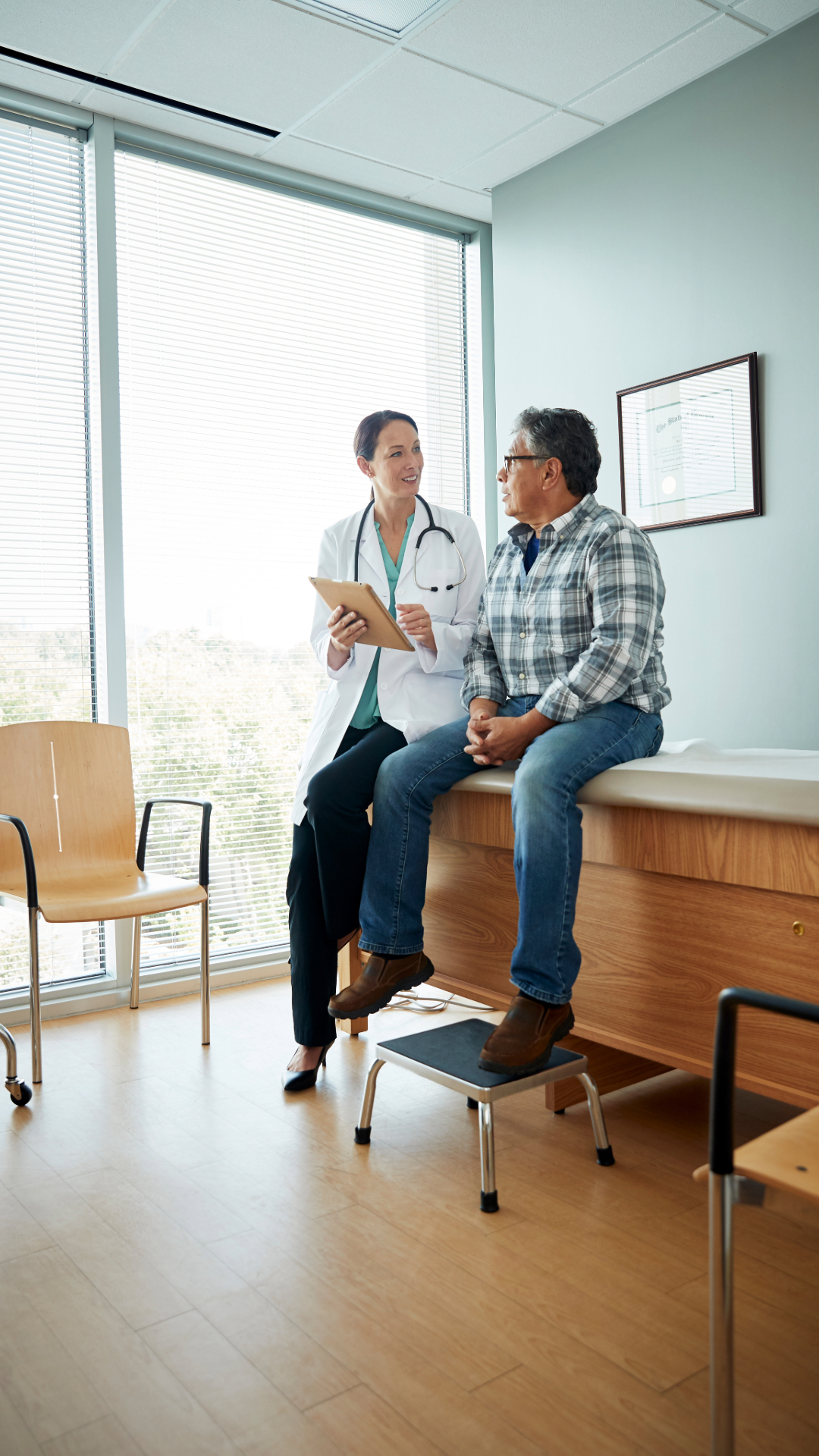 Provider consulting one-on-one with a patient in the exam room